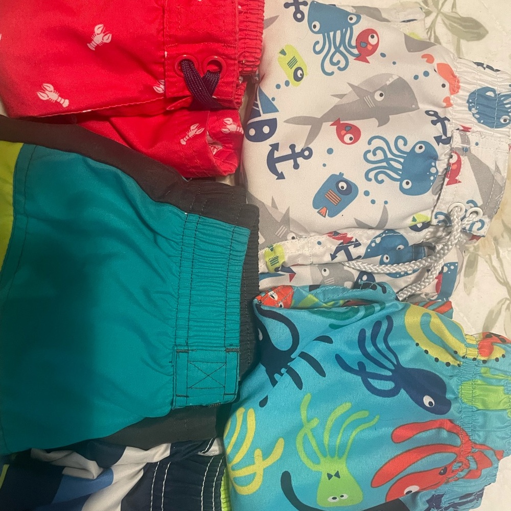 Boys 3T swim shorts, girls 9 and 12mo